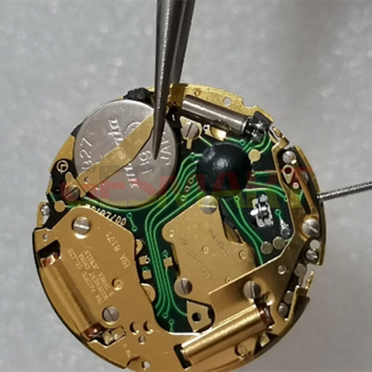 ISA 8171 golden quartz watch movement with date at 3, multi-function repair part for precision timekeeping.