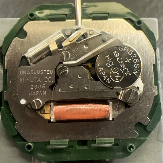 Japan-made Miyota 2305 quartz watch movement with date at 6, black disk, precise timekeeping.