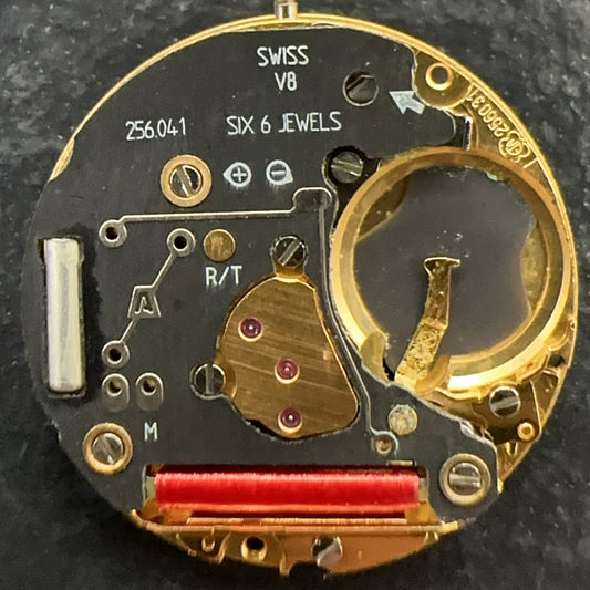 Swiss Made ETA256.041 quartz movement watch part with black dial and date at 6, ideal for repairs.