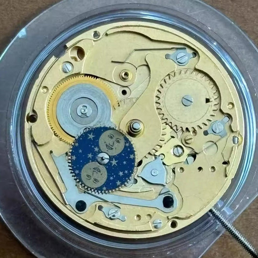 Swiss Made ETA255.483 watch movement displaying moon phase and small second at 6, precision quartz timing.