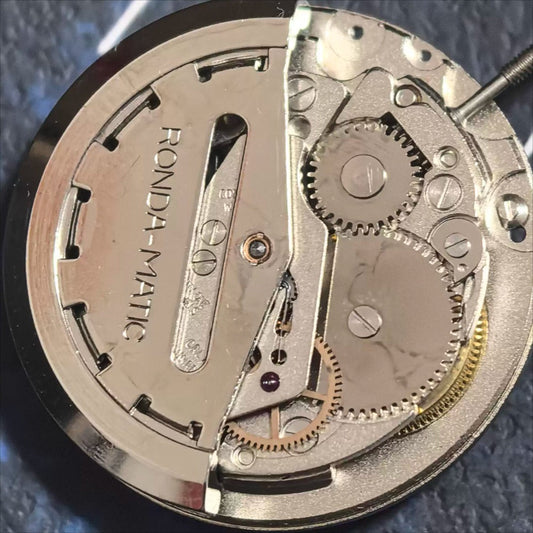Swiss Made ETA CAL1219 watch with mechanical movement, double calendar, and red font detailing