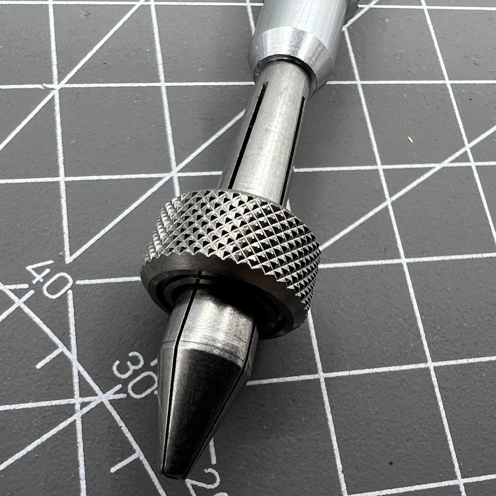 Holder clamp tool pin vice for precise watch crown lever repair.