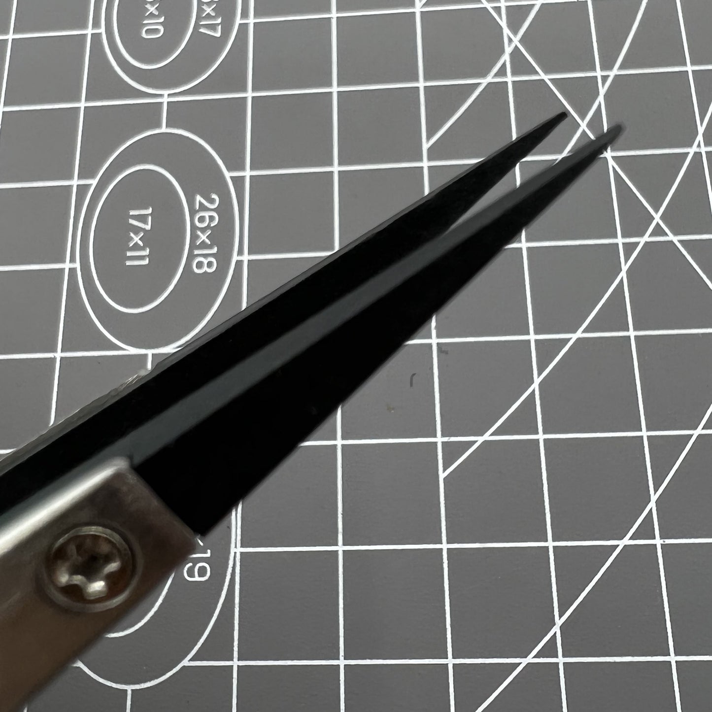 Stainless steel Carbon Fiber Head Tweezers for precise watch repair tasks.