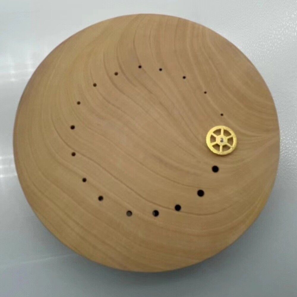 Boxwood watch hand wheel holder for precise balance wheel repair by skilled watchmakers.