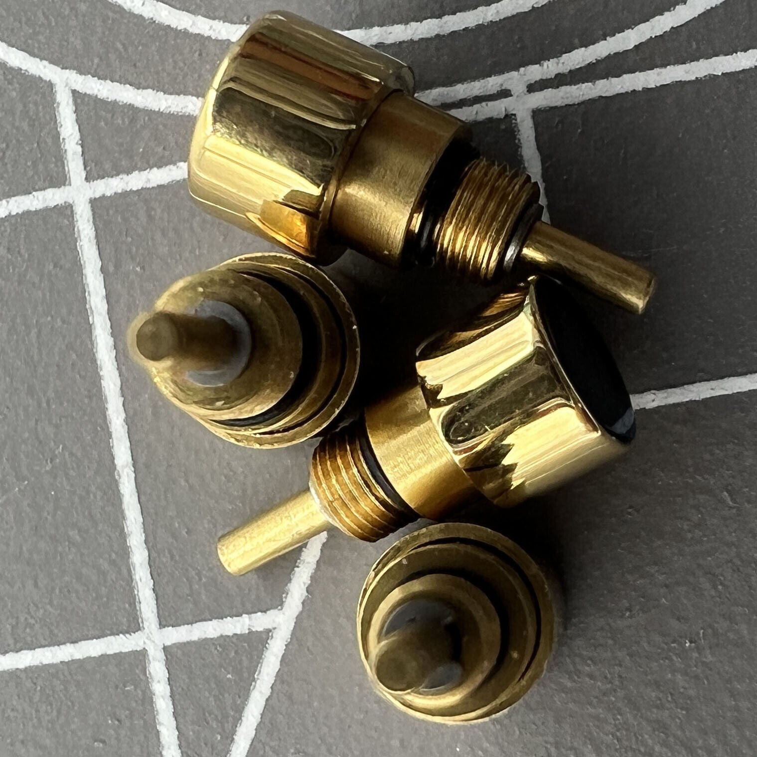 Golden 14-piece set of stainless steel watch pushers in 7 sizes, durable and precise for watch repairs.