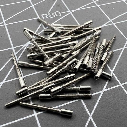 Set of 100 0.9mm watch winding stems extensions for precise watch repair and customization.