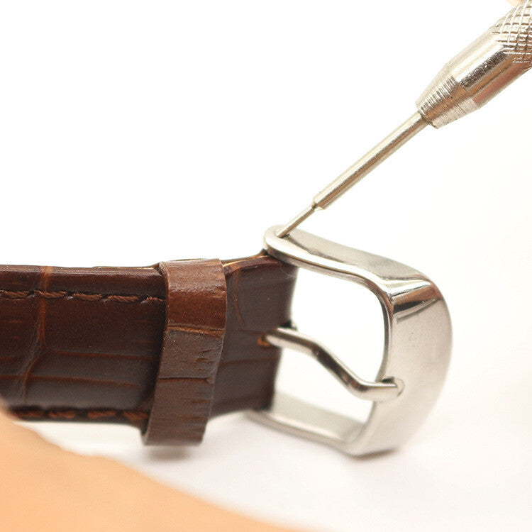 Durable watch band link remover kit with hammer and holder for precise strap adjustments.