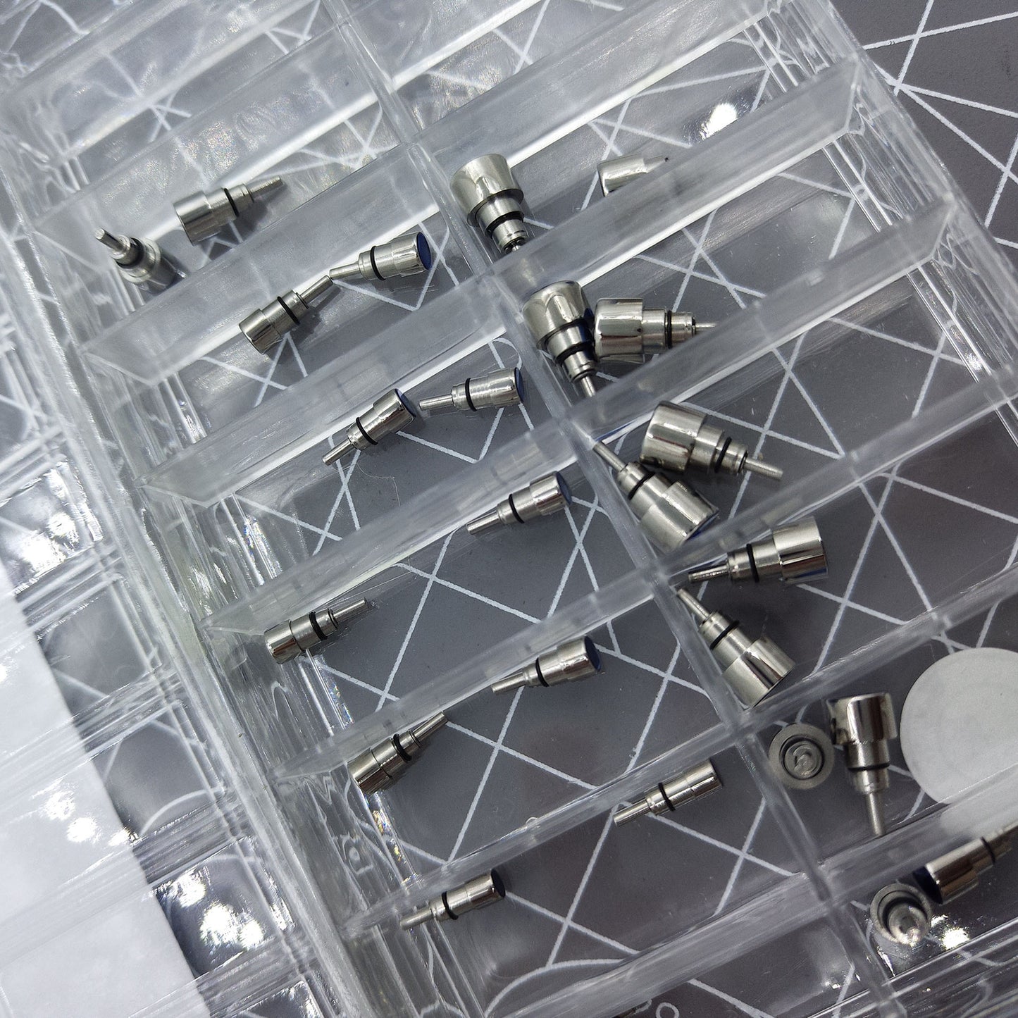 Classic stainless steel chronograph button set with 26 screw-in pushers for precise watch repair and customization.