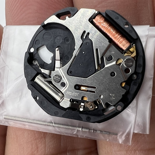 Hattori Epson VX12 quartz watch movement showing date at 3 and 6, precision Japan-made part