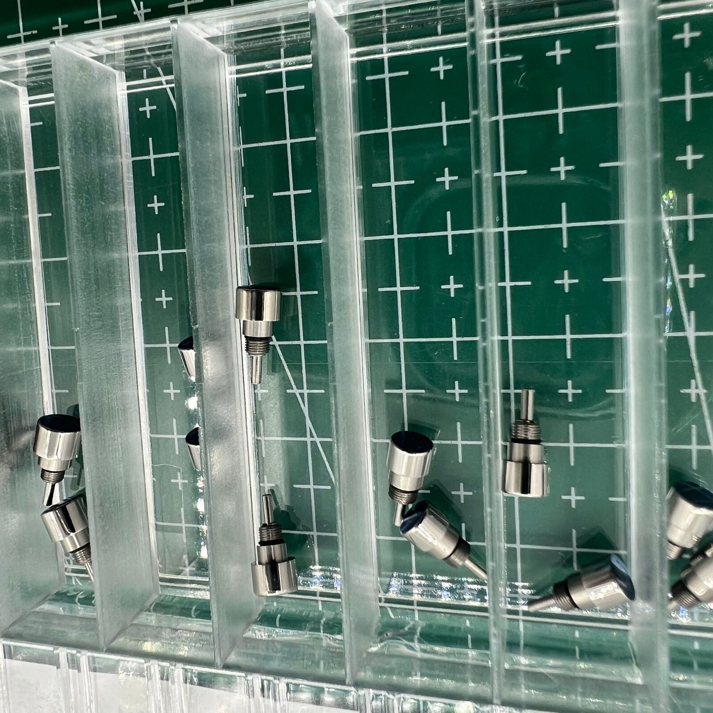 Silver stainless steel watch accessory with classical pusher drive, enhancing elegant timekeeping.