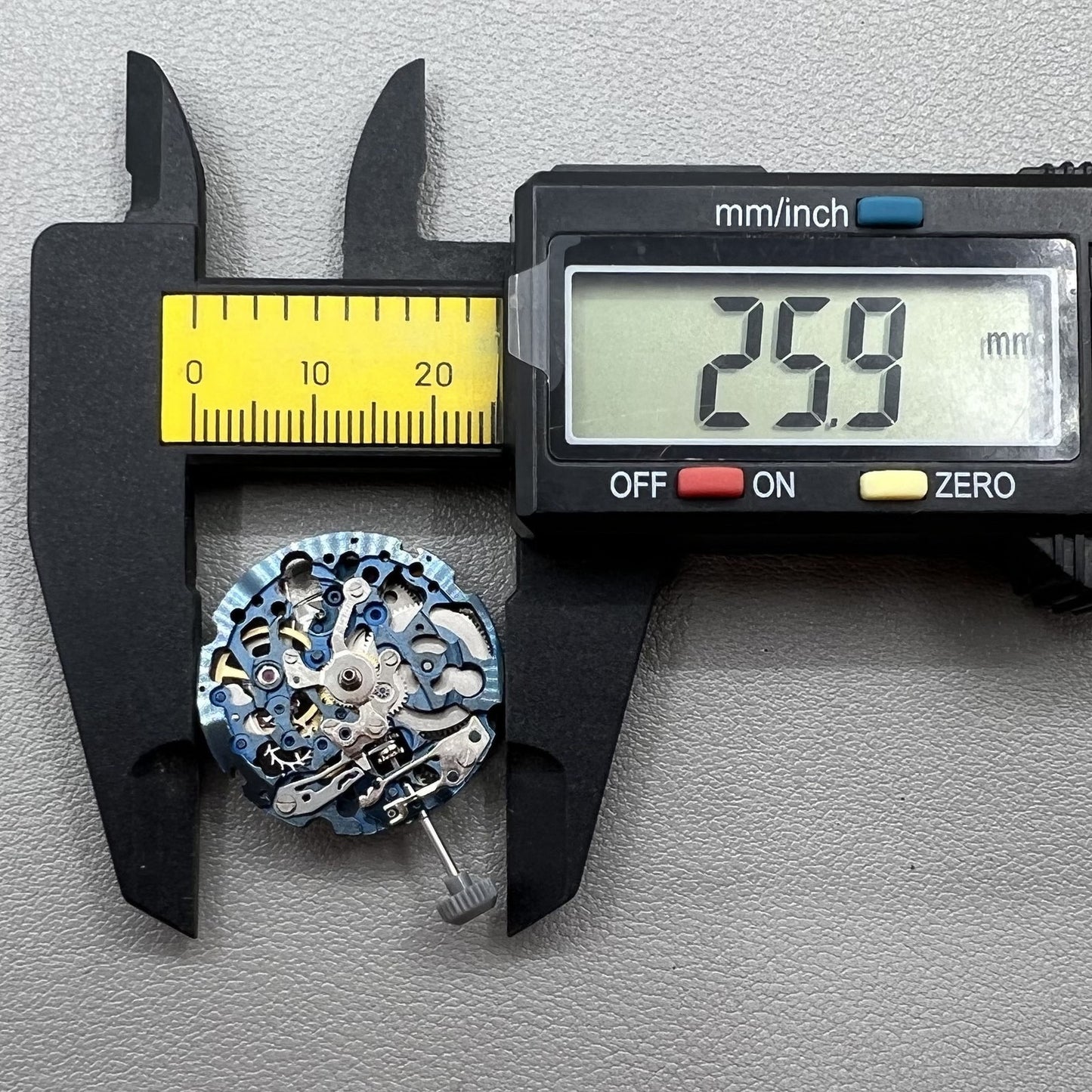 Miyota 8N24 blue hollow automatic mechanical watch movement for precise and reliable timekeeping.