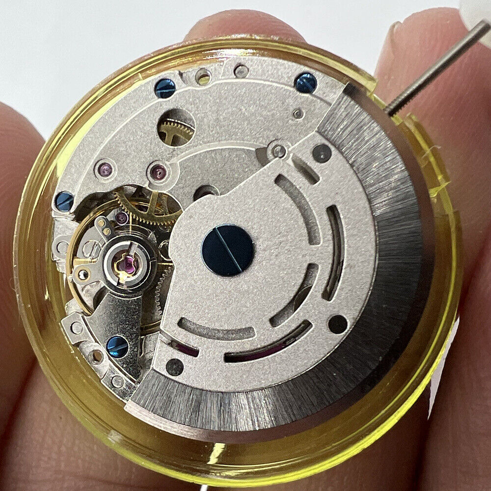 DG2813 automatic watch movement featuring 3 hands and 24-hour silver display window for accurate timekeeping.