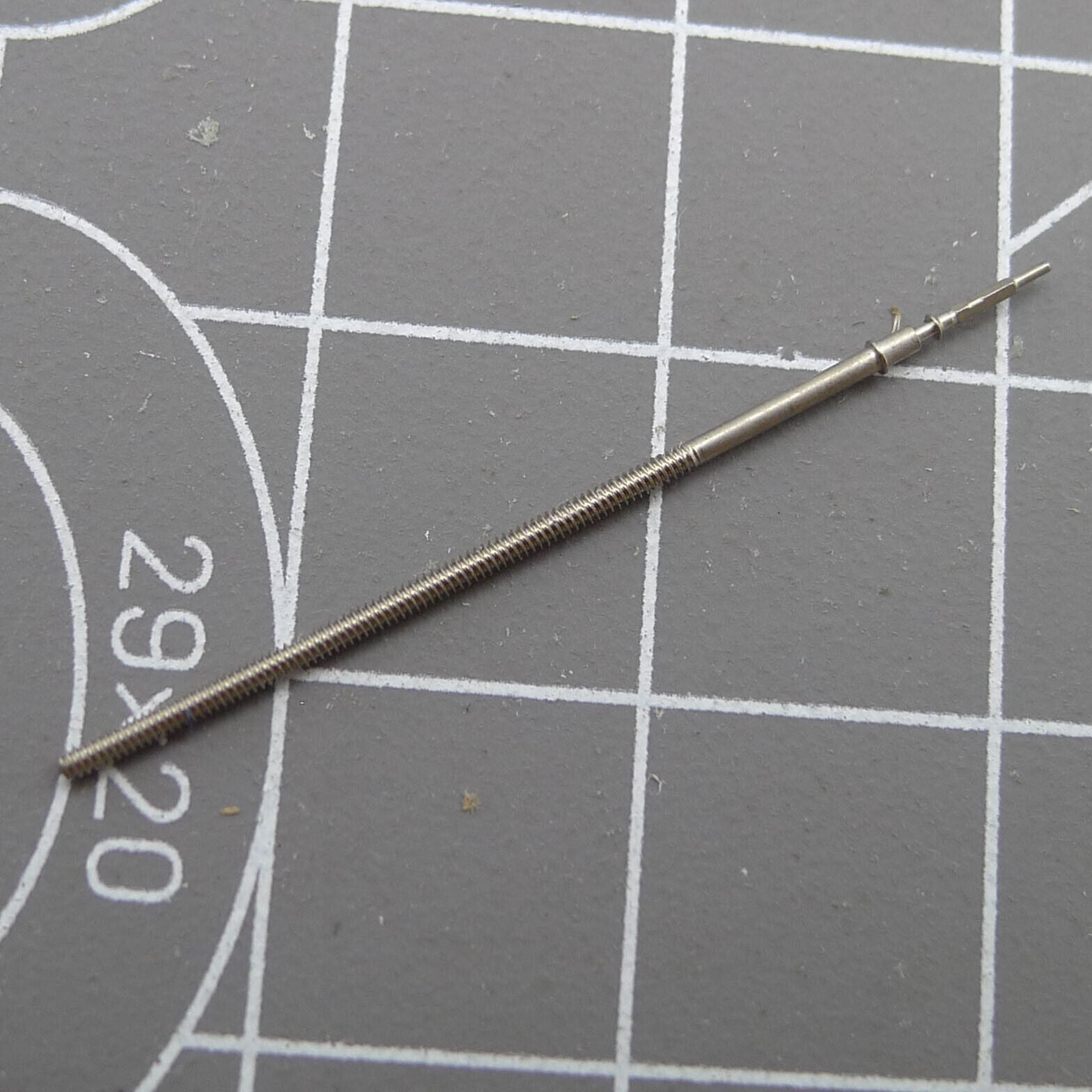 Replacement winding stem for Epson VR33 quartz watch movement, durable and precise.