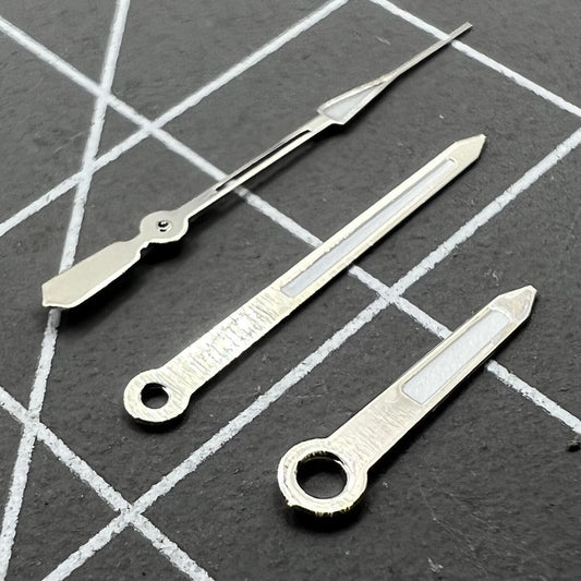 14mm silver trimmed watch hands with green lume, compatible with Ronda 515 quartz movement, for precise timekeeping.