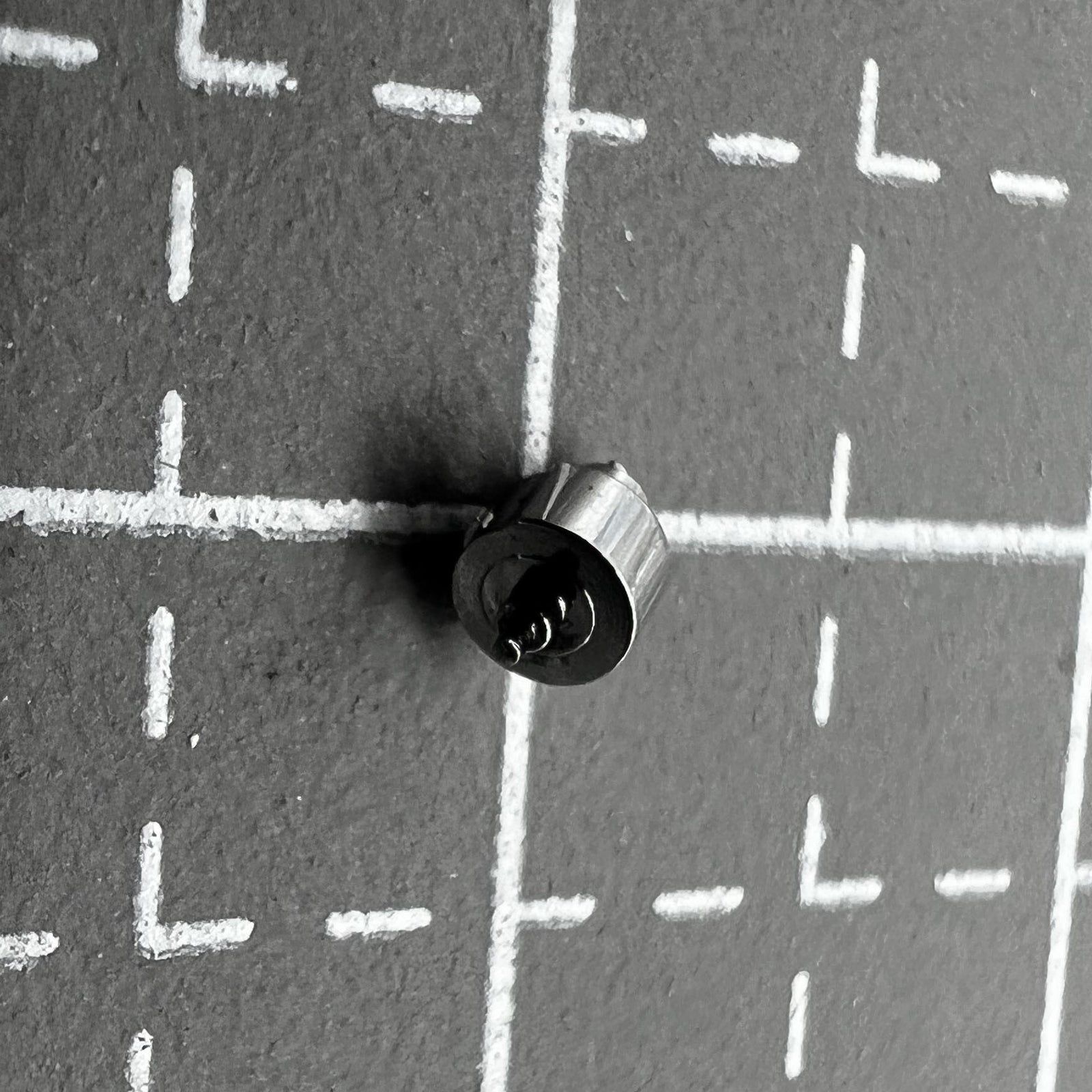 Original Axis of Barrel with complete mainspring for Omega 3313/3303 movement, precision watch accessory by Omega.