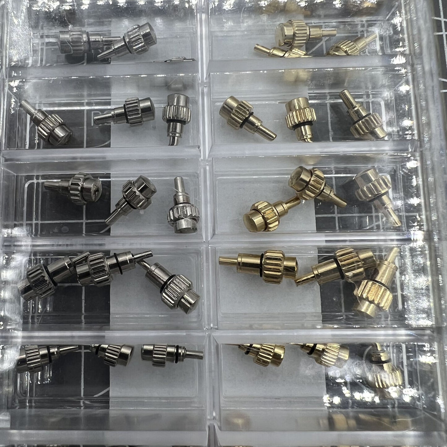 Set of 54 AB-619PCF watch crown chronograph pushers with flat head for precise button repair and replacement.