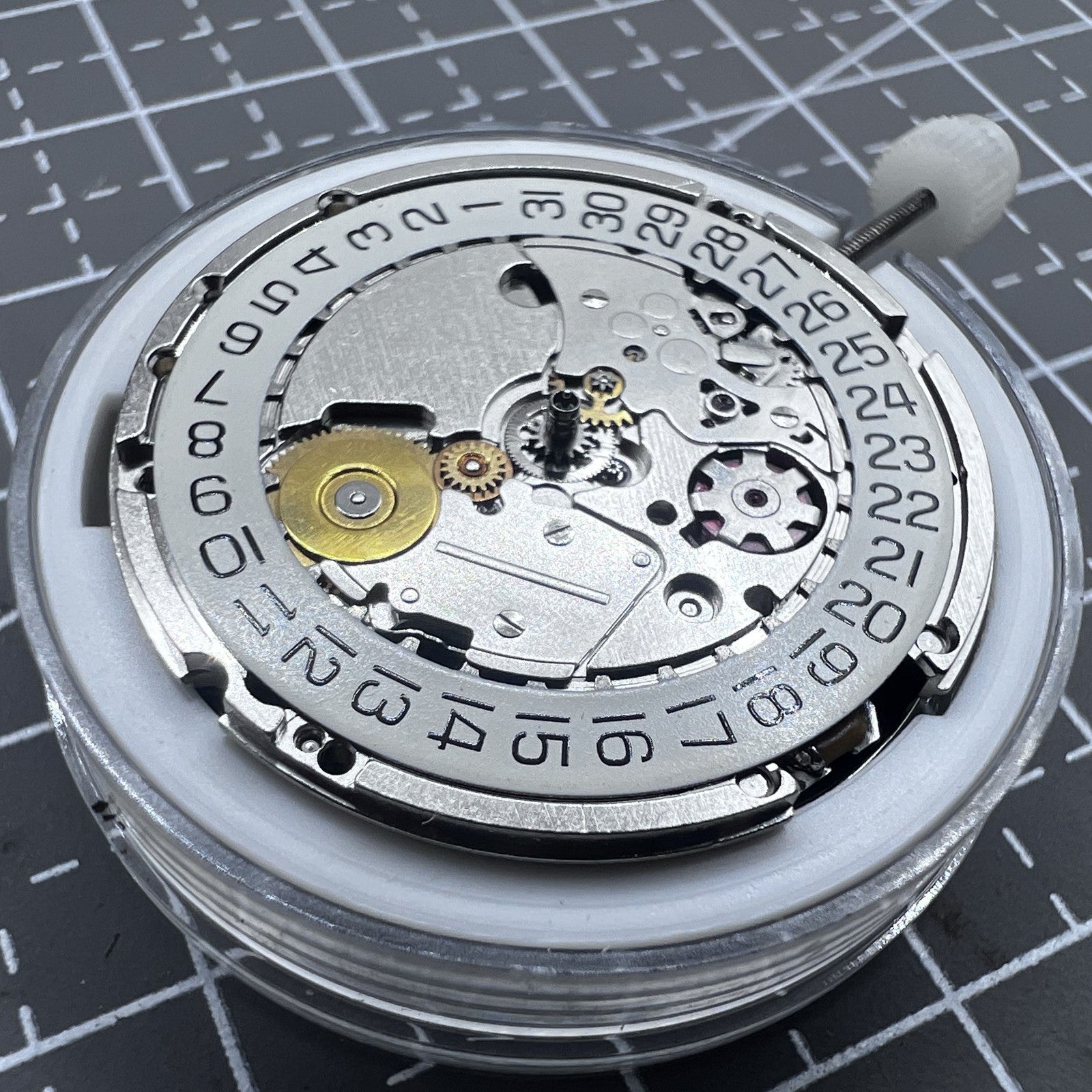 Swiss Silver ETA 205.111 kinetic watch movement, precise replacement part for watch repair and maintenance.