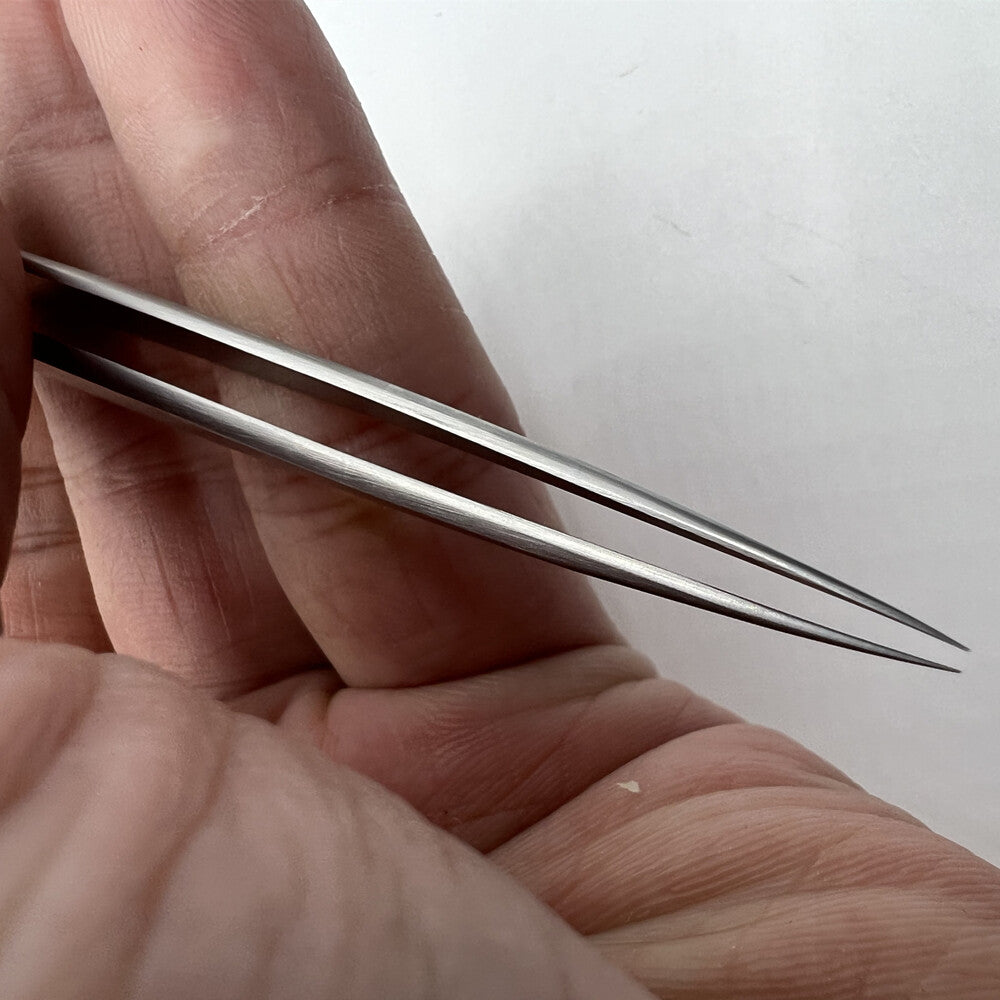 Bergeon 7027-SS stainless steel tweezers with narrow fine tips for precise watch repair and maintenance.