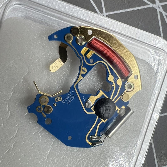 Circuit board with ETA 956.412 quartz movement components for Swiss-made watch repair.