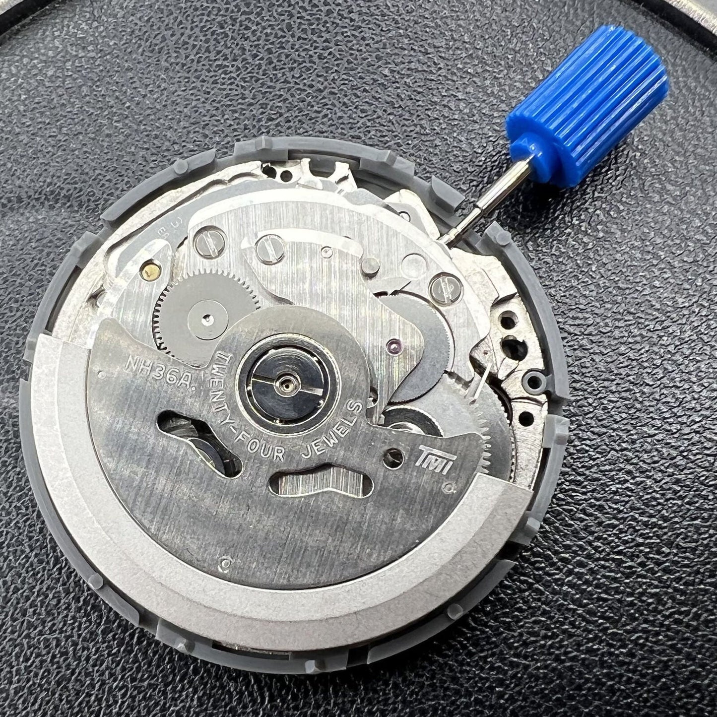 Black NH36A automatic mechanical watch movement featuring a Roman wheel crown at 3 o'clock.