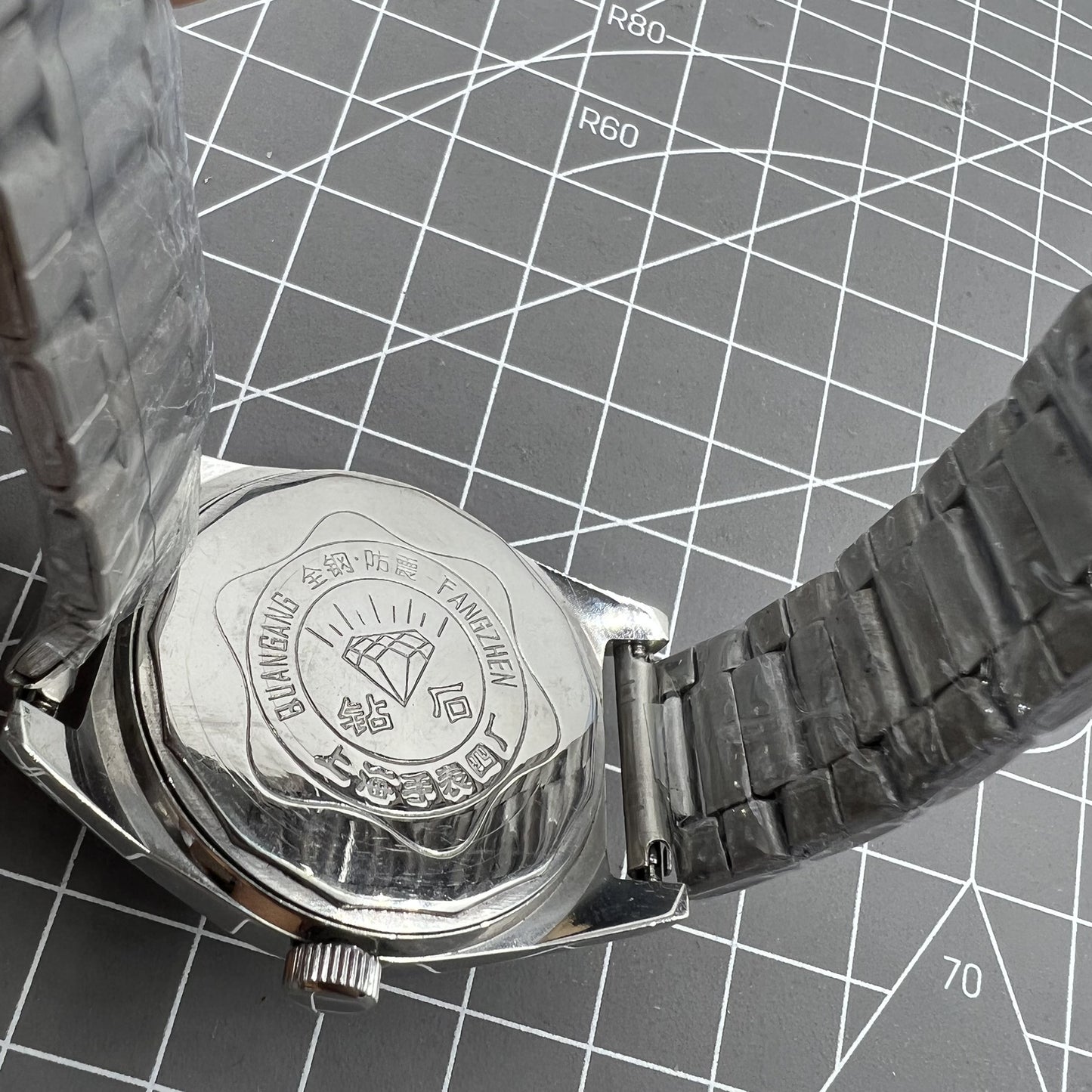 Shanghai Diamond 38mm manual watch with white dial, silver case, 17 jewels for precise timekeeping.