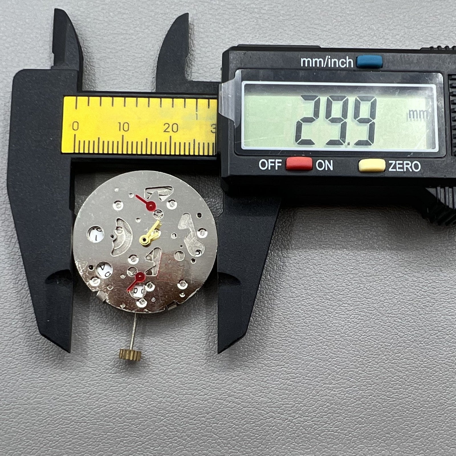 China Made 7120 watch with mechanical movement, date display at 3, and second hands at 3/6/9 positions.