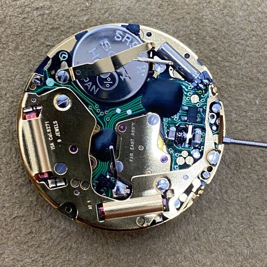 Golden watch part featuring Swiss ISA 8271 quartz movement with date at 6, ideal for precise repair.