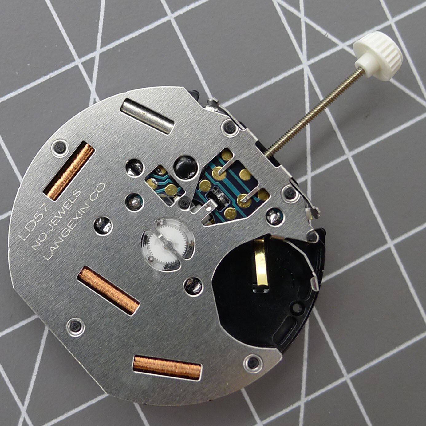 LD57 quartz watch repair part with small second subdial at 6, 9, and 12 o'clock for precise timing.