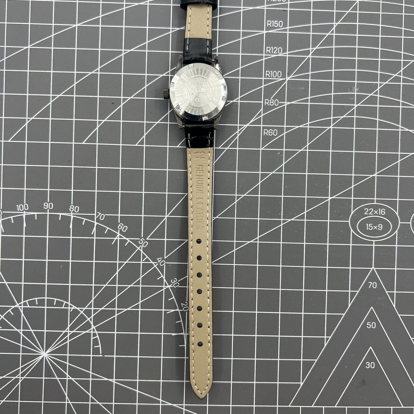 Seagull black ladies watch with gold nail markers, manual mechanical movement, and shock resistance.