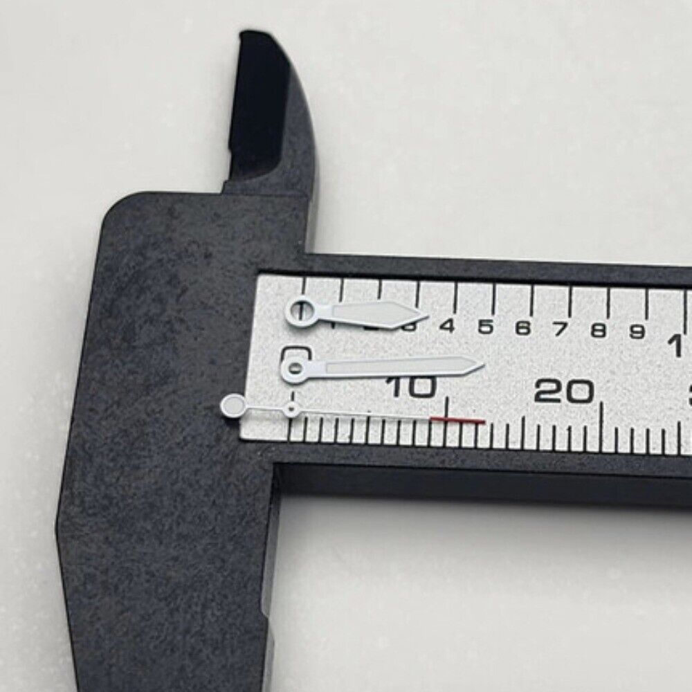 White-trimmed arrow-shaped watch hands with green lume and red tips, compatible with NH35 NH36 movements.