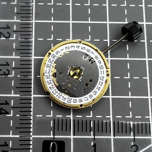 ETA F03.115 quartz watch movement showing three hands and date at 3, precision timekeeping by ETA.