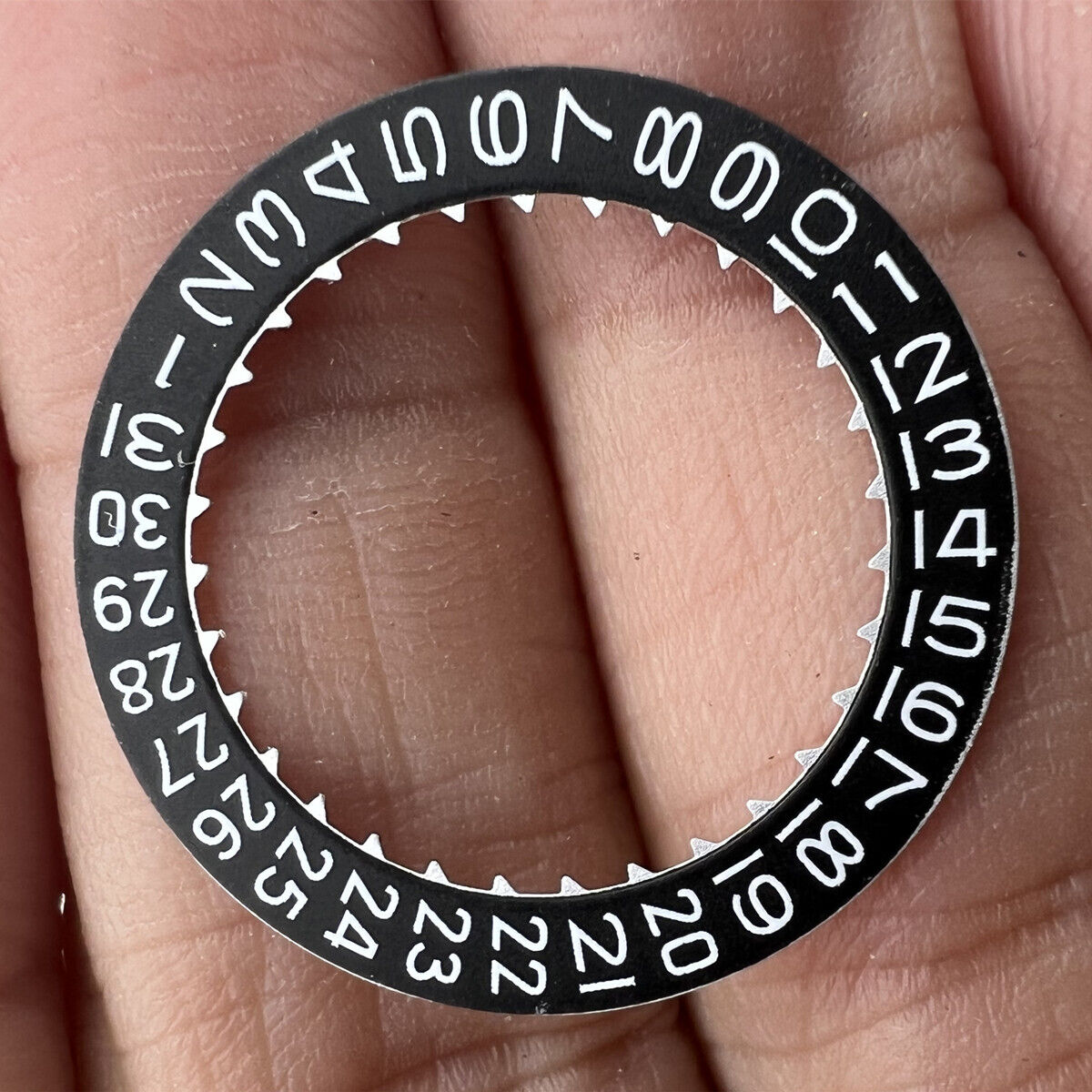 Japan Made black date disk wheel by Miyota, showing date at 3 o'clock for watch repair.