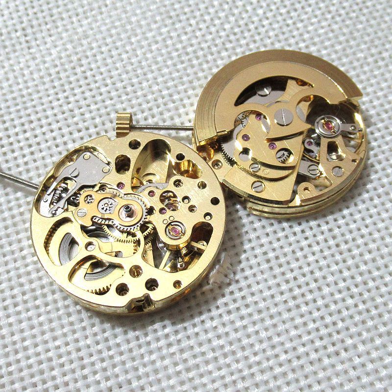 Golden 26.5mm DANDONG 7120 automatic watch movement with hollow design showcasing precise mechanical craftsmanship.
