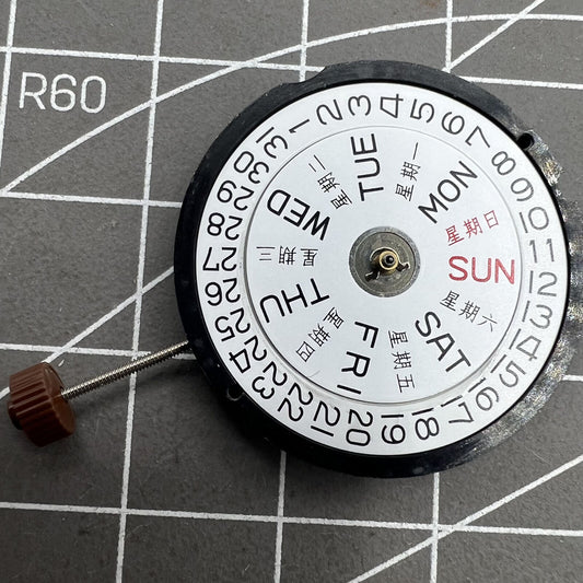 Ronda 517 quartz watch movement showing English & Chinese day date at 3 o'clock for precise timekeeping.