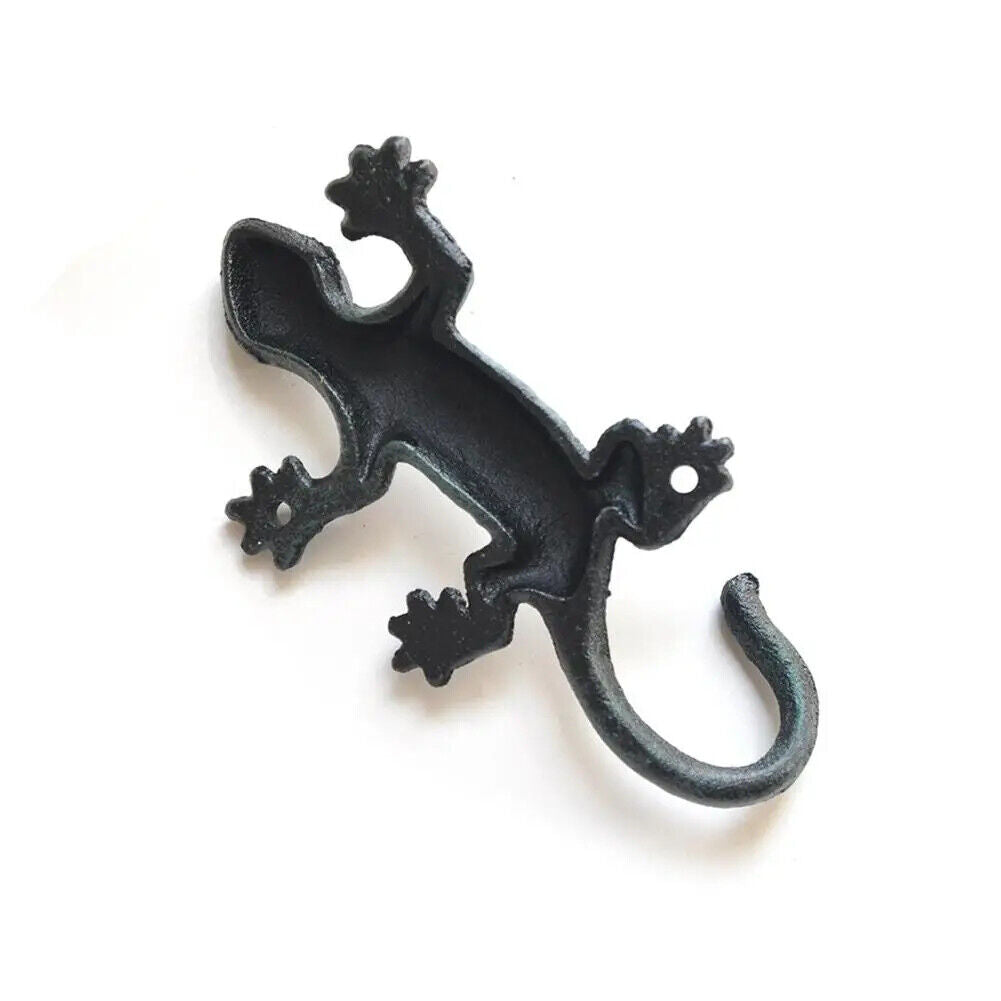Vintage cast iron gecko wall hook, perfect for hanging clothes and garden tools with rustic charm.