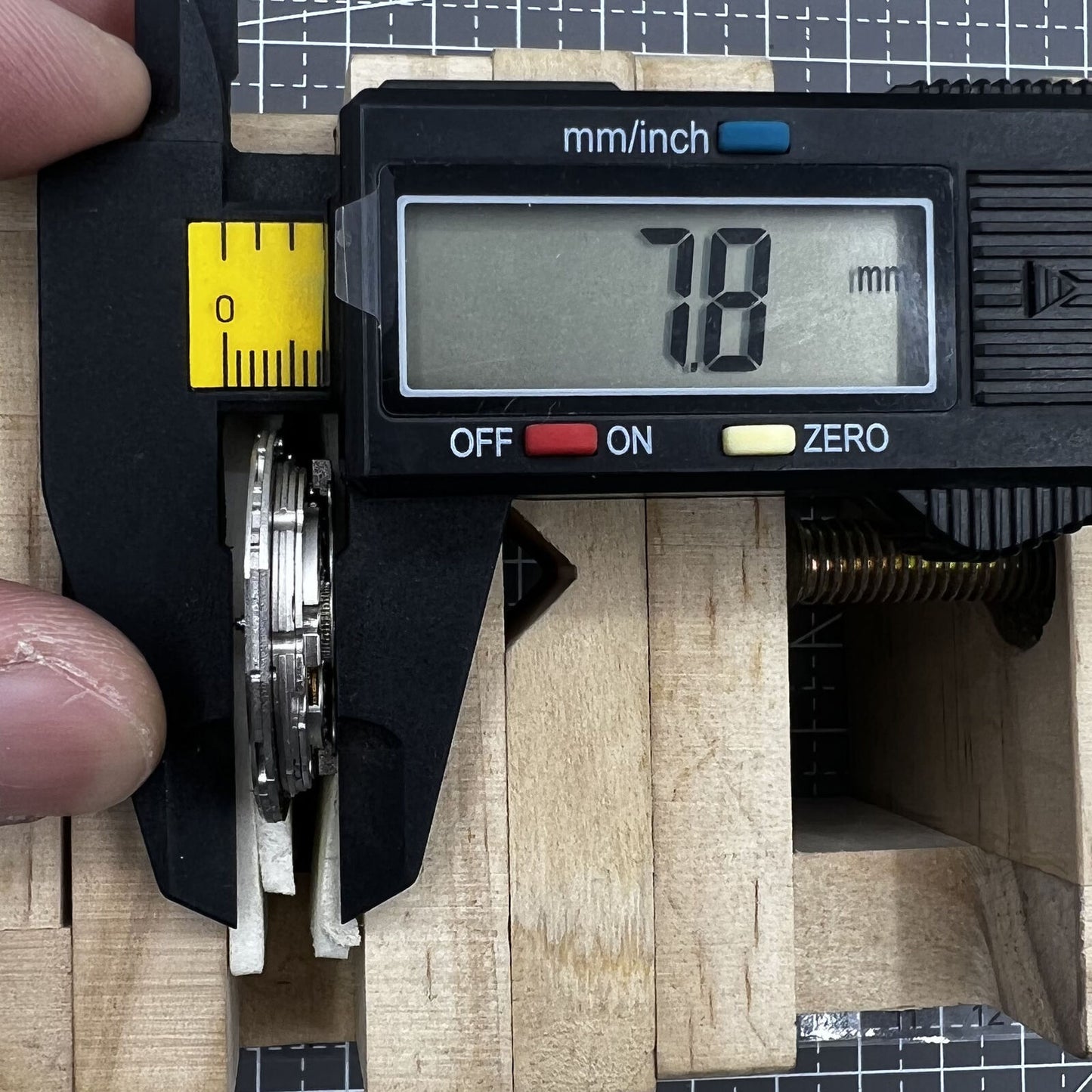 Miyota 9110 automatic watch movement showing date at 3 o'clock, precise mechanical craftsmanship.