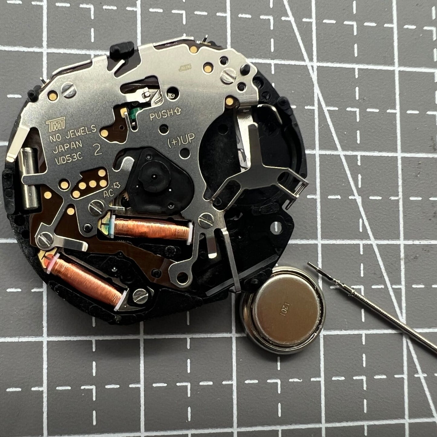 Hattori Epson VD53C quartz watch movement showing date at 6 o'clock, Japan-made for accuracy.