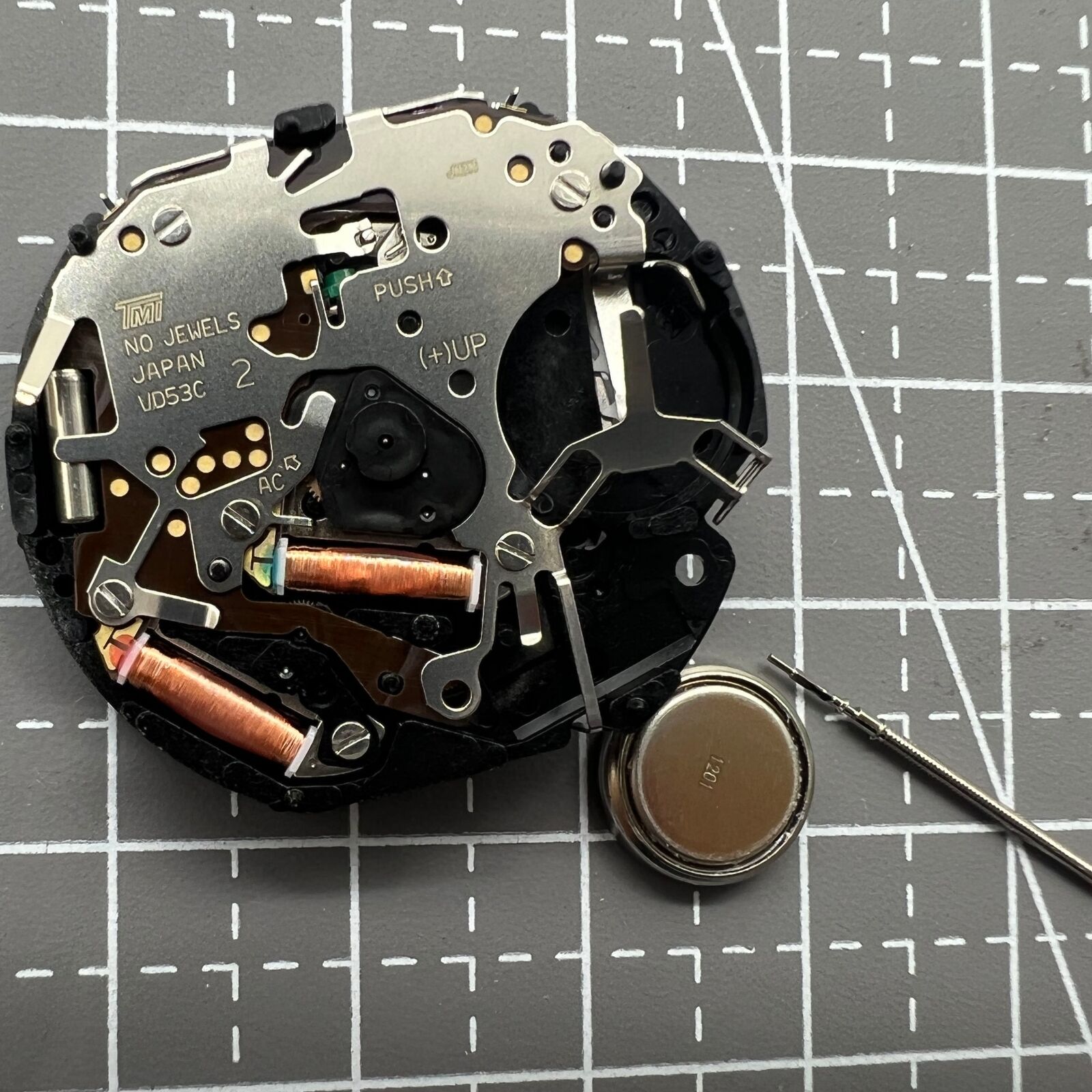 Hattori Epson VD53C quartz watch movement showing date at 6 o'clock, Japan-made for accuracy.