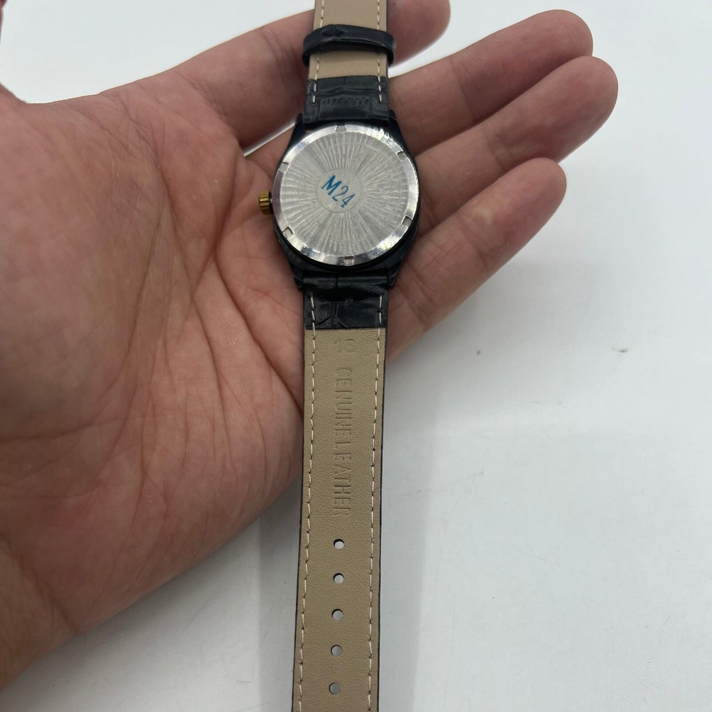 33mm Shanghai Factory manual watch with black dial, double calendar display, and classic mechanical design.