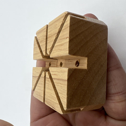 Wooden watch band bracelet holder with strap pins remover tool for watch repair.