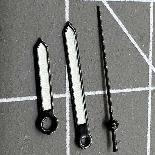 Luminous black trim watch hands for Miyota 2035 quartz movement, enhancing visibility and style.