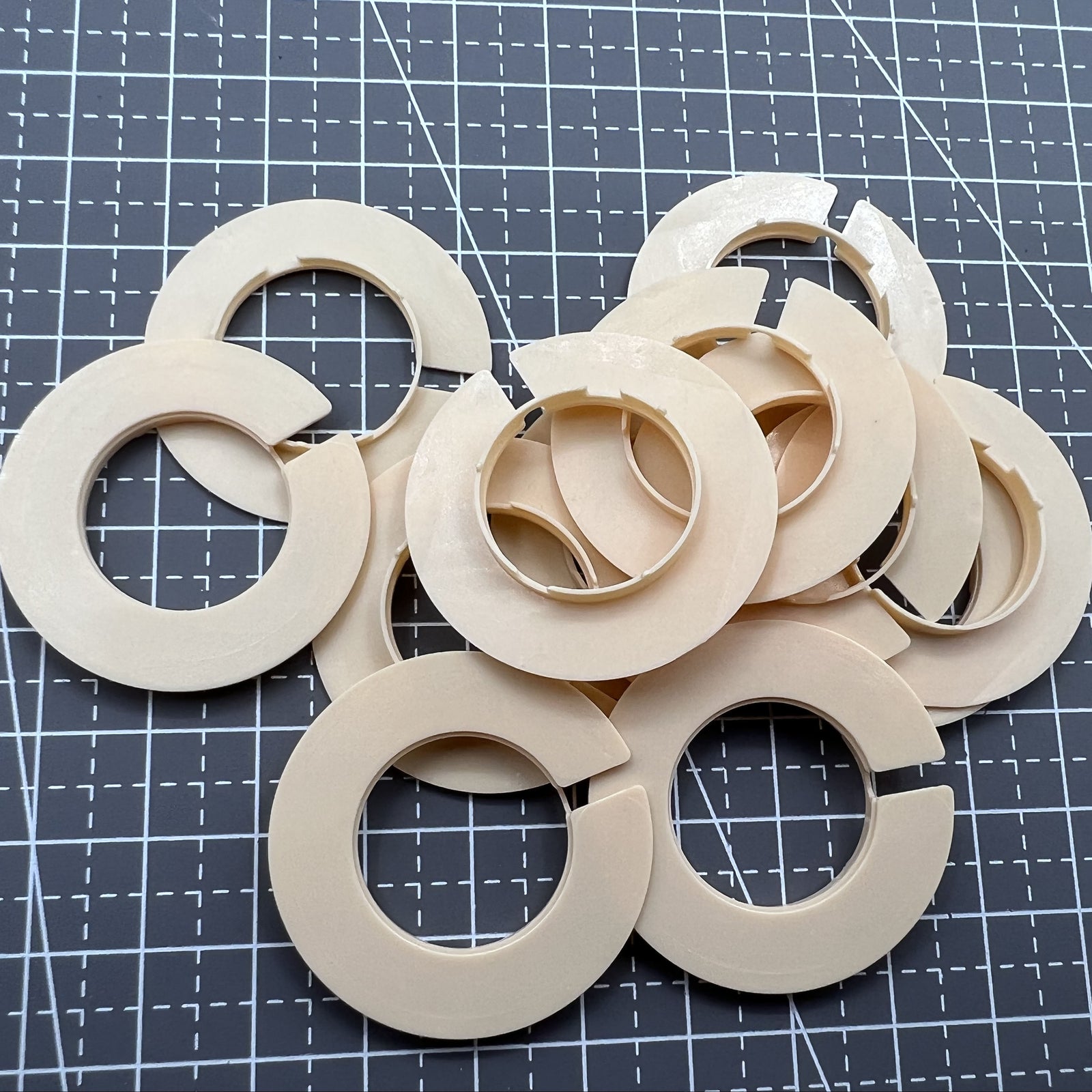 Set of 12 T-676 watch movement spacer rings size 8.75 for precise casing adjustments.