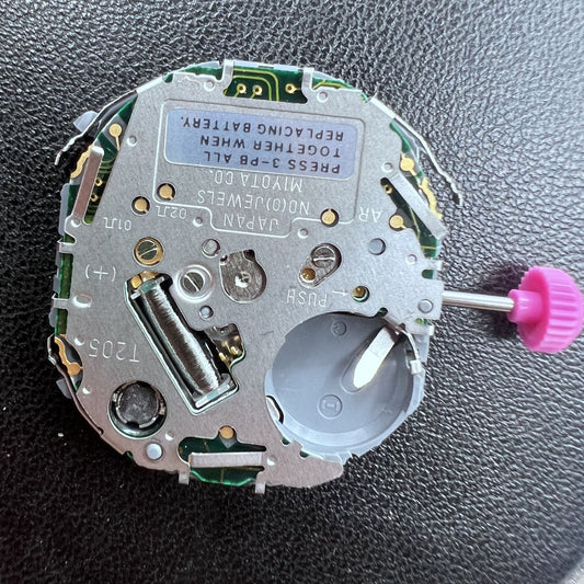Japan Miyota T205 quartz watch movement showcasing precise timekeeping with visible display.