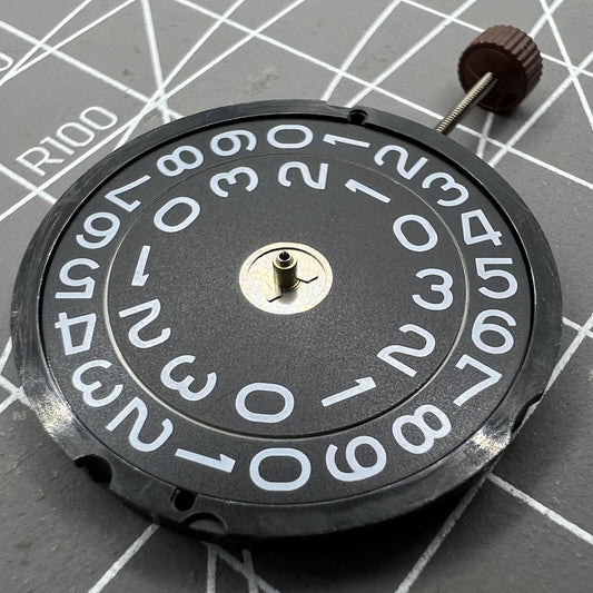 Swiss Made Ronda 519 quartz watch movement with black disk, precision for watch repairs and upgrades.