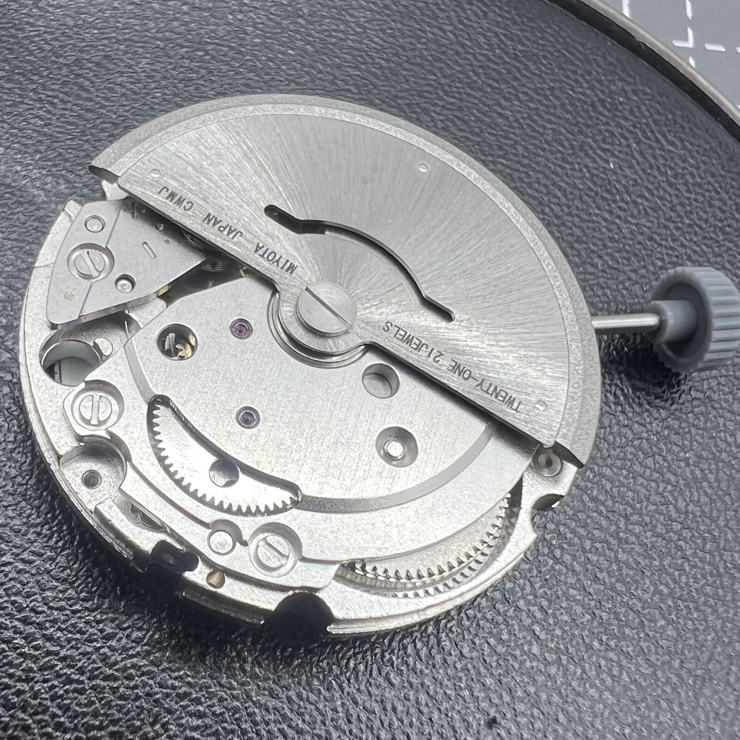 Miyota Citizen 8215 automatic watch with black dial, date display at 3 o'clock, and sleek stainless steel case.