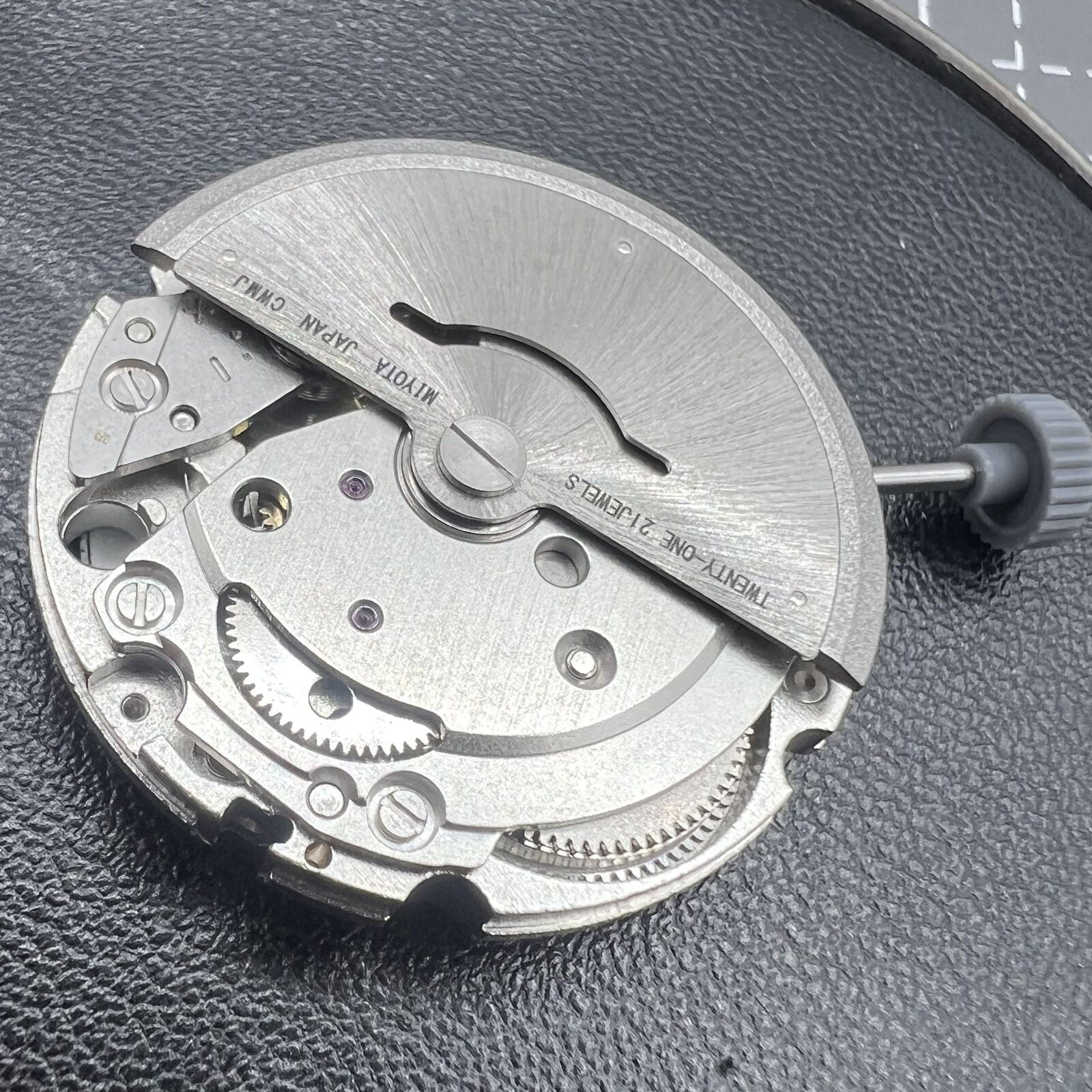 Miyota Citizen 8215 automatic watch with black dial, date display at 3 o'clock, and sleek stainless steel case.