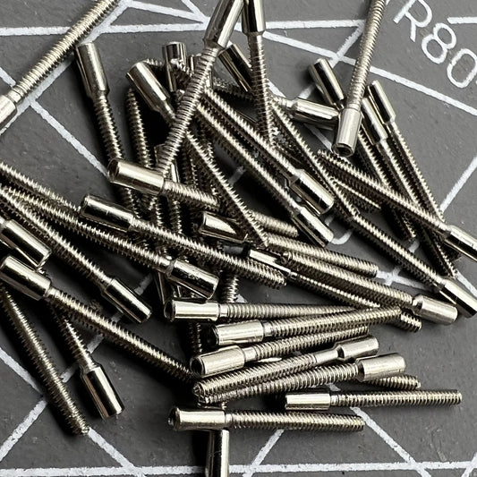 Set of 100 0.9mm watch winding stems extensions for precise watch repair and customization.