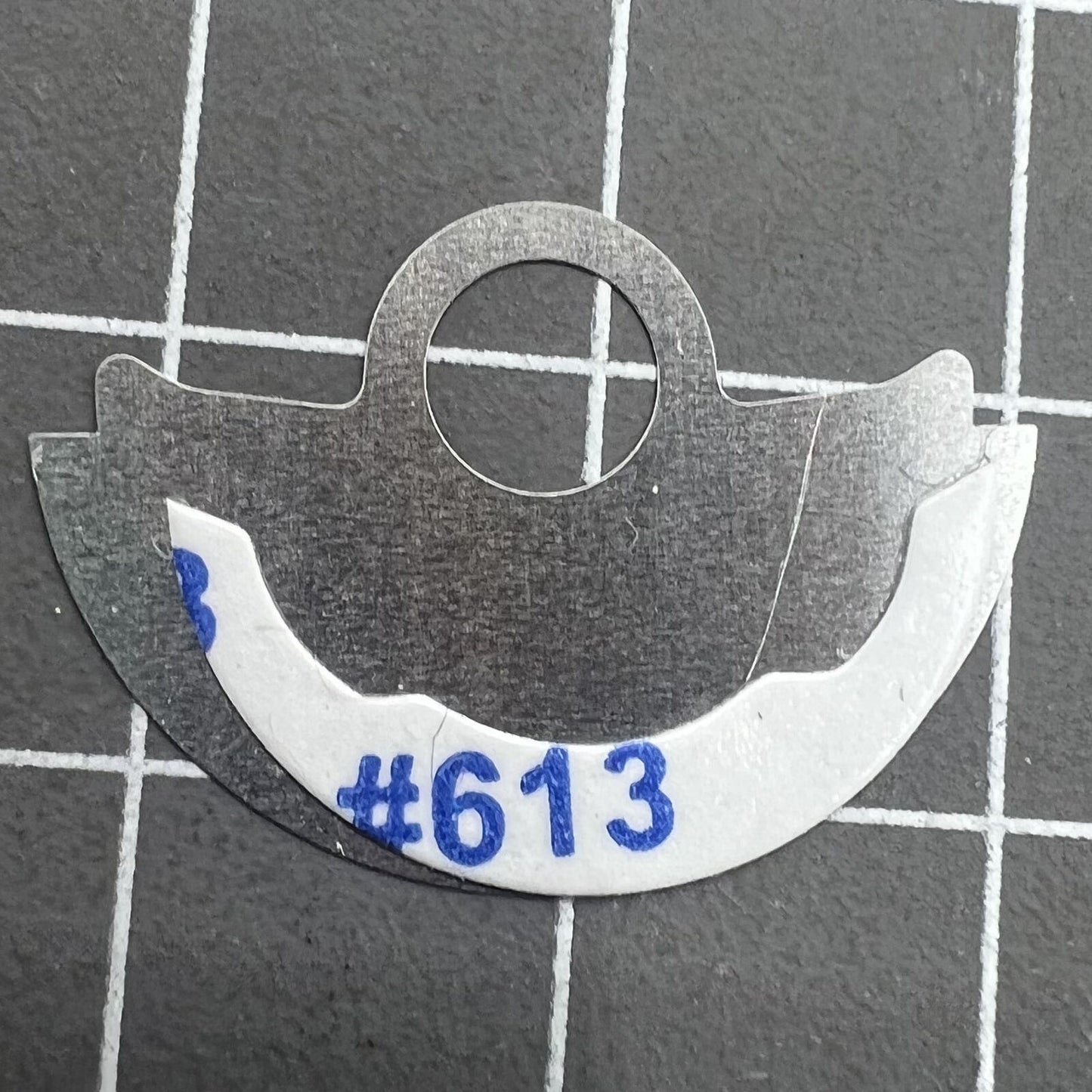 Hammer Miyota 9015 rotor with waved silver metal sheet overlay for improved watch movement performance.