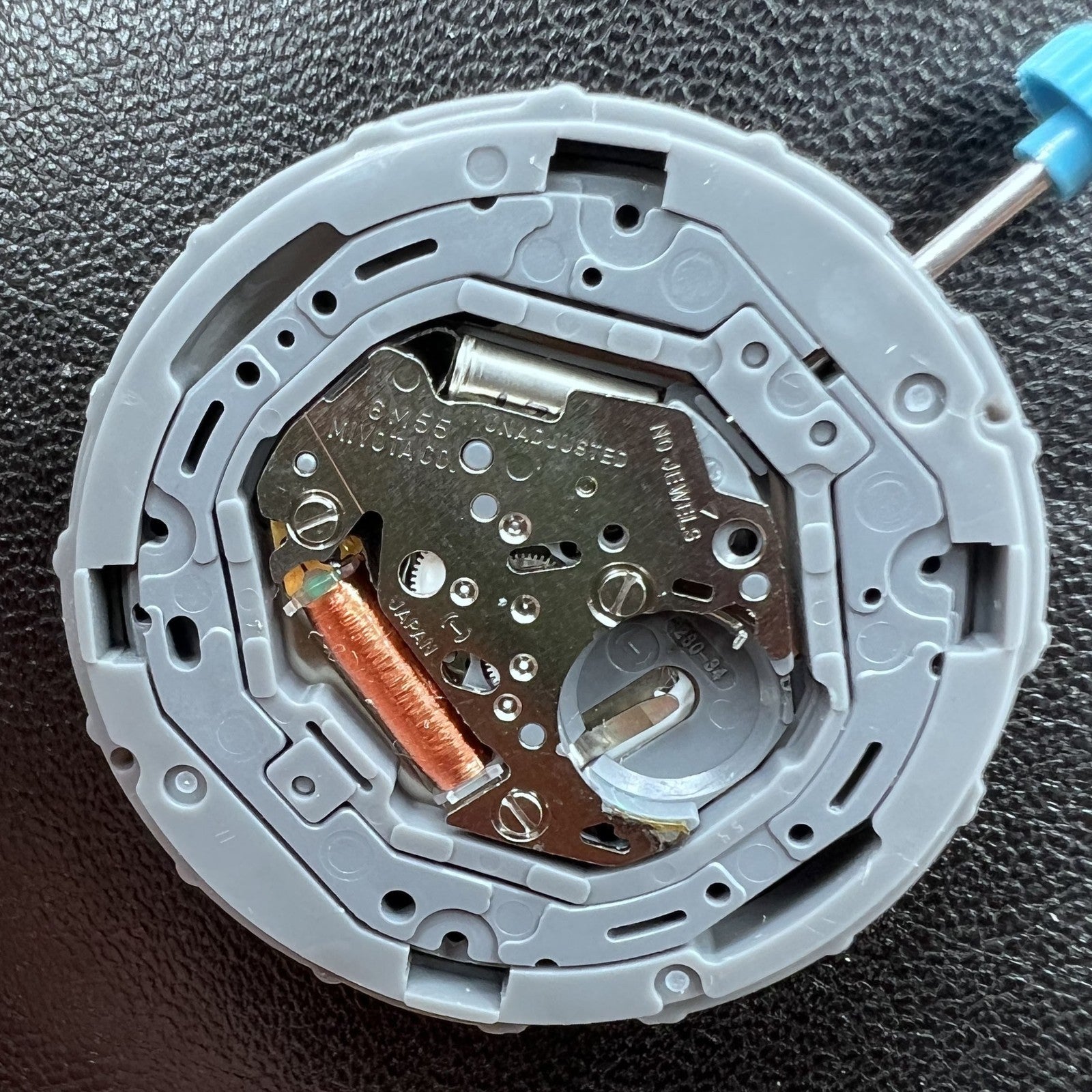 Japan Miyota 6M55 quartz watch movement with 3 hands and date display at 3 o'clock, precise timekeeping.