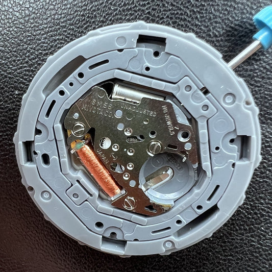 Japan Miyota 6M55 quartz watch movement with 3 hands and date display at 3 o'clock, precise timekeeping.